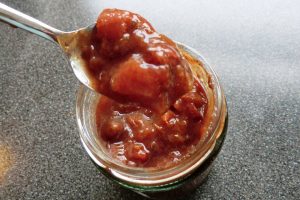 Spooning out gooseberry chutney